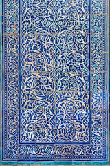 Beautiful intricate pattern in oriental style on tile of ancient wall in old city, Khiva, Uzbekistan - obrazy, fototapety, plakaty