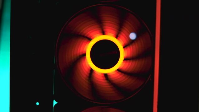 An integral part of a computer, a spinning fan. Clip. Close up of cooling system of a modern computer.