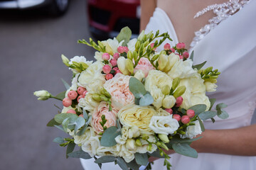 Bridal Bouquet In Brides Hands. Bride in the garden.