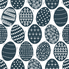 Navy blue and white Scandinavian Easter seamless pattern for spring celebrations. Fun moving and dancing dyed Easter eggs are cute and fun. Geometric pattern on the eggs is modest and neutral.