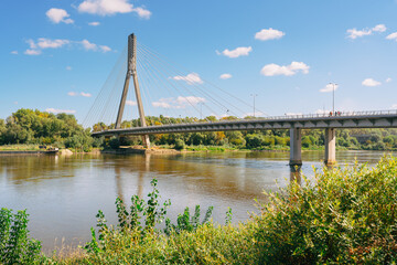 Bridge over the Vistula river in Warsaw, Poland, in a bright sunny day