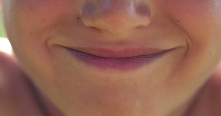 Positive child mouth and lips smiling feeling happy macro close-up