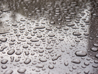 Water drops on shiny surface close up texture