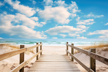 Obraz premium a wooden pier leading to the beach in a sunny day, wooden boardwalk leading to shore. 