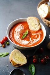 Homemade Tomato Bisque or Soup served with crostini in a bowl