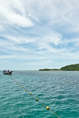 KOH MUD SUM ,THAILAND; SEPTEMBER 08 ,2023;Many long tail boat waiting to transport tourists at Koh Mud Sum small island near Koh Samui island, Thailand.