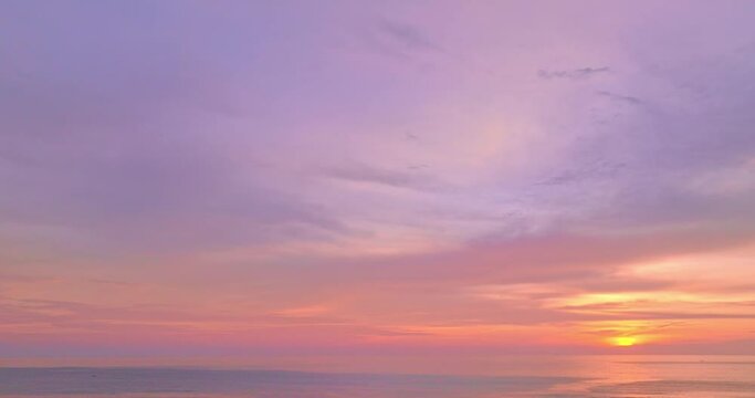 amazing pink cloud in purple sky in beautiful sunset above the sea..beautiful sunrise landscape amazing light of nature sky over horizon..colorful sky sunset or sunrise background.