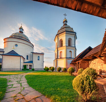 Wonderful summer sunset on Basilian Monastery of Jasna Gora. Splendid evening scene of Hoshiv countryside, Ivano-Frankivsk region, Ukraine, Europe. Traveling concept background.