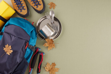 Exploring the beauty of autumn on a hike. Top view of metal utensils, trekking boots, hiking...