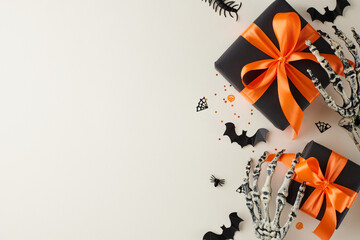 Elevating Halloween offerings for cherished ones. Top view of gift boxes with orange ribbons,...