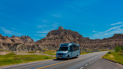 Traveling in Rv on open road through the badlands of South Dakota on a beautiful day