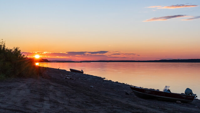 Boats on Riverbank at Sunset, Fort Simpson, Northwest Territories, Canada