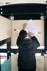 Girl copying homework on playground
