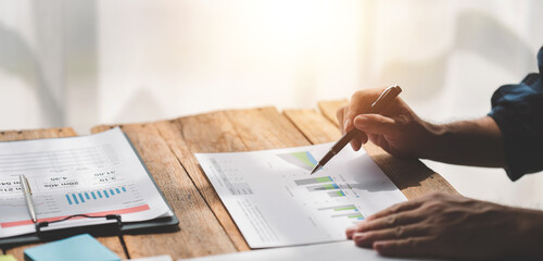 Portrait of a male businessman working using a tablet computer in a modern office. Prepare account analysis reports Real estate investment information Financial and tax system concepts