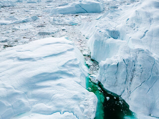 Greenland Ilulissat Icefjord Aerial View. Iceberg and glacier ice in Arctic nature landscape in...