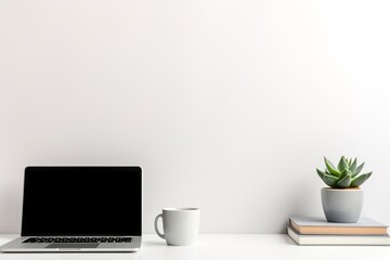 A minimalist workspace setup, with a laptop, a pot of succulent, a diary, and a cup of coffee, radiating productivity vibes against a white backdrop