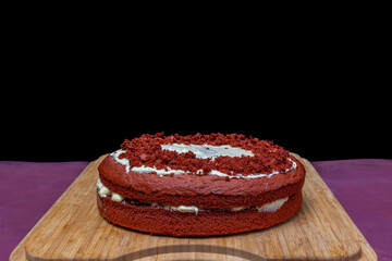 Red velvet cake homemade on wooden chopping board