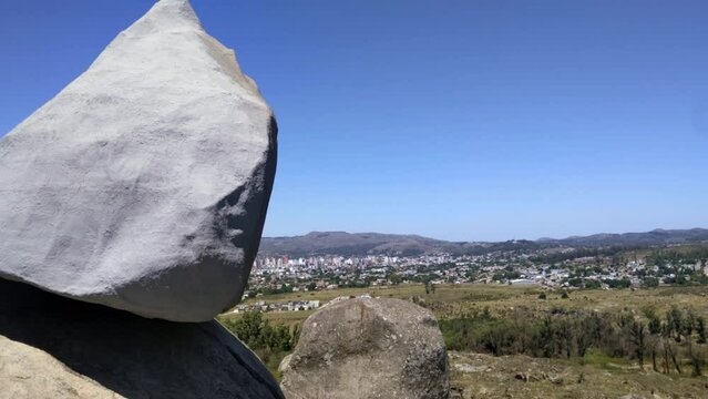 The Famous "Moving Rock" located in an Area of Eroded Hills with the City Called Tandil in the Background, Buenos Aires Province, Argentina.
