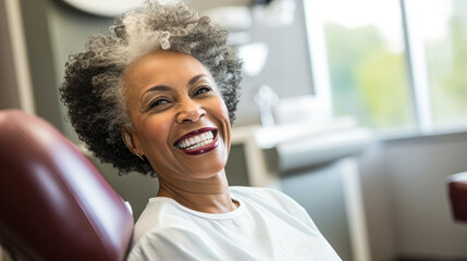 Portrait of a happy dark-skinned adult woman in a dental office. African American woman undergoes a consultation with a dentist in a specialized clinic. Dental health concept.