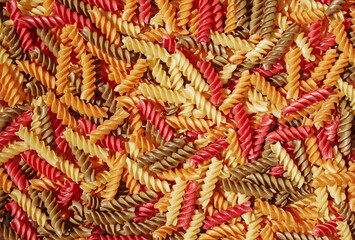 Colorful pasta fusilli noodle abstract background