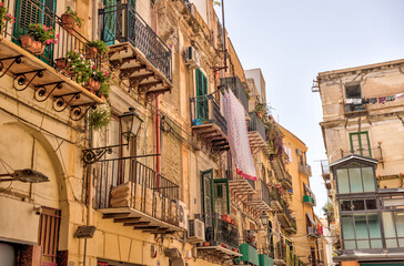 Fototapeta premium Palermo, Italy - July 18, 2022: Classic architecture and building facades on the streets in Palermo 