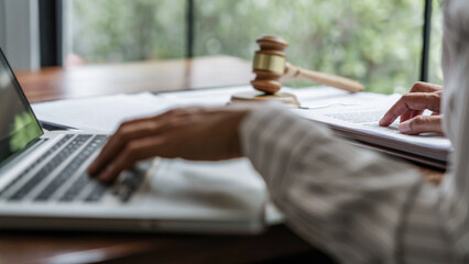 Lawyer working legal data contract at workplace..
