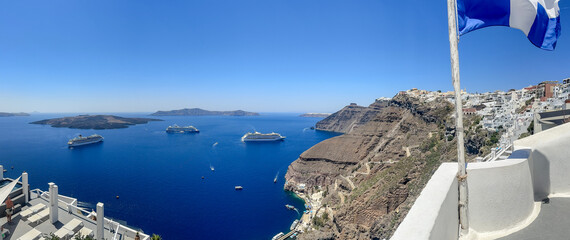 Fira, Greece - July 20, 2023: Views of cruise ships and the rocky landscapes from Fira on the...