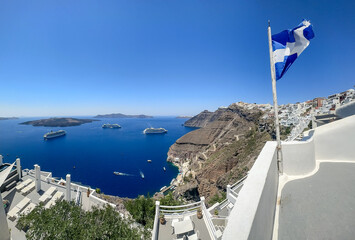 Fira, Greece - July 20, 2023: Views of cruise ships and the rocky landscapes from Fira on the island of Santorini in Greece
 - obrazy, fototapety, plakaty