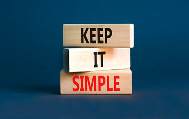 Keep it simple symbol. Concept word Keep it simple on beautiful wooden block. Beautiful grey table...