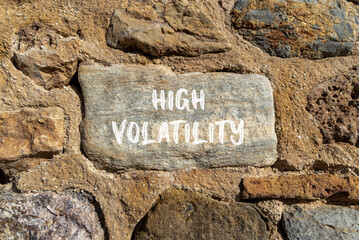 High volatility symbol. Concept words High volatility on beautiful big stone. Beautiful stone wall...