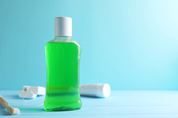 A mouthwash on a colored background. Dental care, dental health.