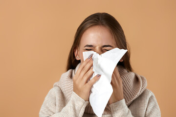 woman in sweater suffering from fever and flu