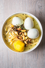 Chicken soup with three eggs. Peruvian food.
