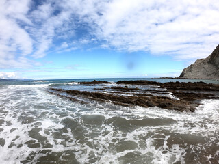 The waters of the Flysch on Zumaia beach