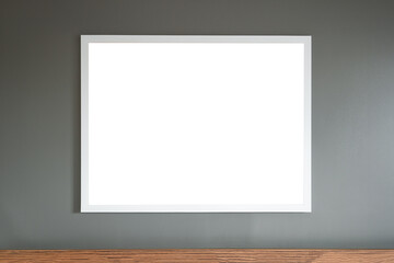 White frame hanging on the grey wall mockup template empty
