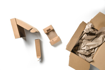 Various packaging made of cardboard boxes and paper, sustainable and plastic-free on a white background, high angel view from above, copy space