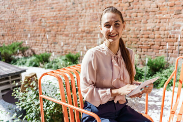 The secretary is a woman in a shirt in modern office clothes working online. A financier is a...