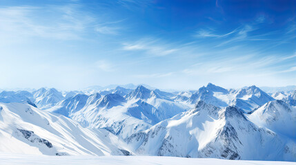 Fototapeta na wymiar A beautiful view of a big snowy mountain range with a blue sky. Ski resort background. 