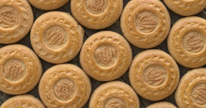 Shortcake biscuits  background texture. Table spin.