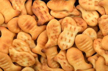 background of cracker cookies in the shape of fish