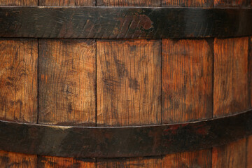 Traditional wooden barrel as background, closeup. Wine making