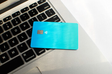 Close-up of a credit card with no apparent logo or brand, representing the abstract concept of payment, symbolizing the universe of financial transactions and electronic payments and purchases.