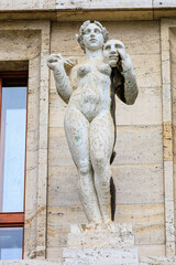 Ancient sculptures in the architecture of the city. Historical and cultural heritage. Background.