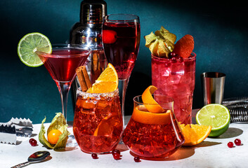 Red cocktails set: kir royale, negroni, boulevardier, cosmopolitan, sea breeze with fruits, berries...