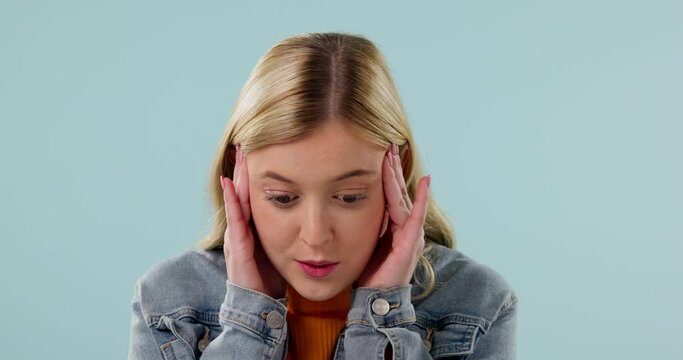 Surprise, face and woman with stress, anxiety and thinking of news, announcement and problem solving a mistake or crisis. Wow, confused and portrait of gen z girl on blue background with headache