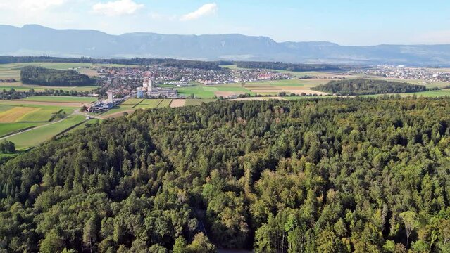 Drone flight with a DJI drone B&auml;tterkinden towards Lohn-Ammannsegg and Biberist towards Solothurn over a lot of green nature near Bern in Switzerland