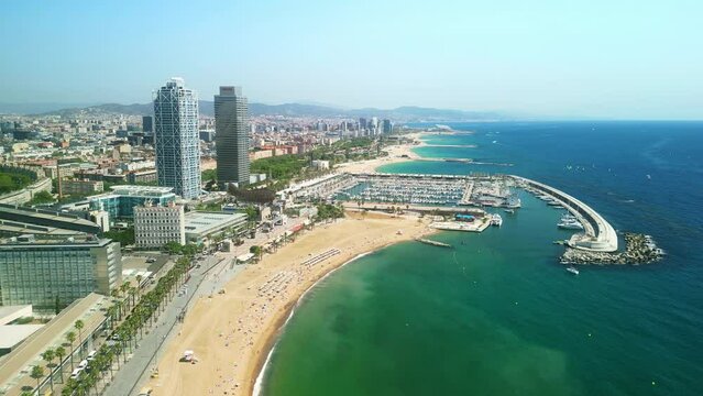 Drone Barceloneta beach. Aerial view of Barcelona coast. travel  destination in Spain. Summer in Mediterranean tourism attraction in Europe. Luxury hotels, modern apartments, yacht harbor.