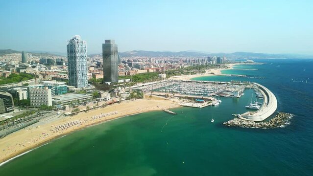 Drone Barceloneta beach. Aerial view of Barcelona coast. travel  destination in Spain. Summer in Mediterranean tourism attraction in Europe. Luxury hotels, modern apartments, yacht harbor.