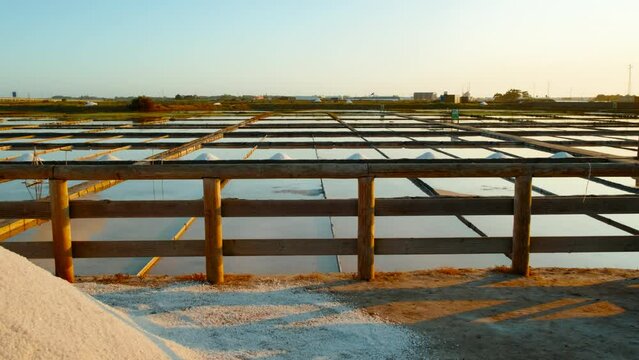 The salt ponds or salt fields of Aveiro, Portugal by sunset, perfect shimmering mirrors that capture the essence of this coastal town