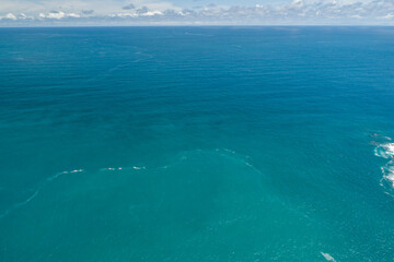 Waves sea water surface nature background,Sun rays over sea, Bird's eye view ocean in sunny day,Sea...
